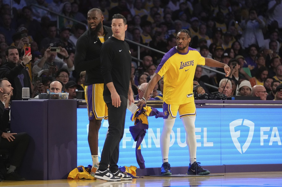 LeBron and Bronny James prepare to check into an NBA game.