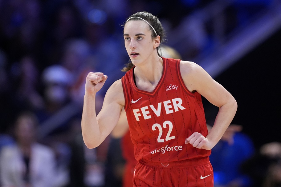 Caitlin Clark pumps her fist after a play