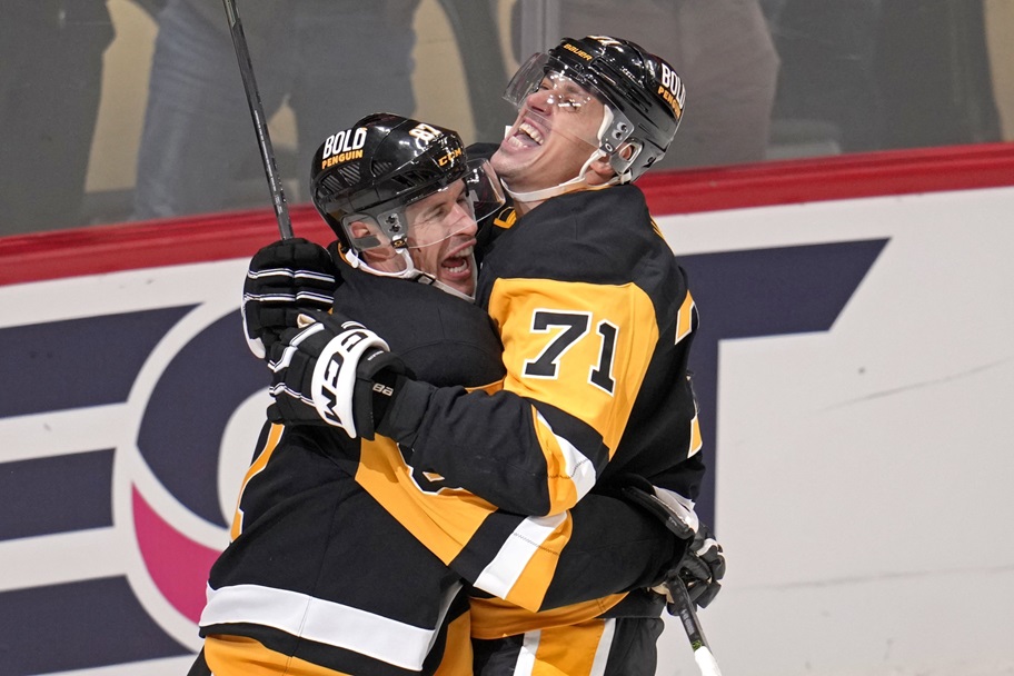 Sidney Crosby and Evgeni Malkin celebrate an NHL goal